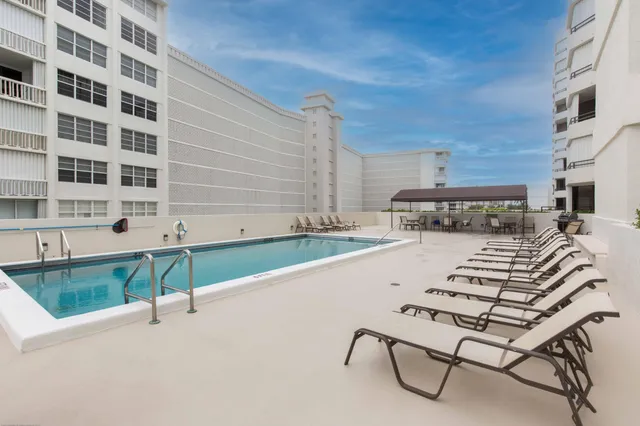 a view of balcony with wooden floor and fence