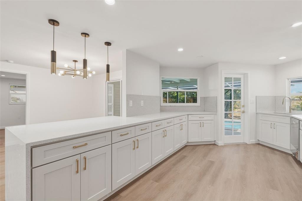 1330 Horizon Road Venice, FL 34293 - Photo 9 of 40 a view of a kitchen with lot of cabinet and a window