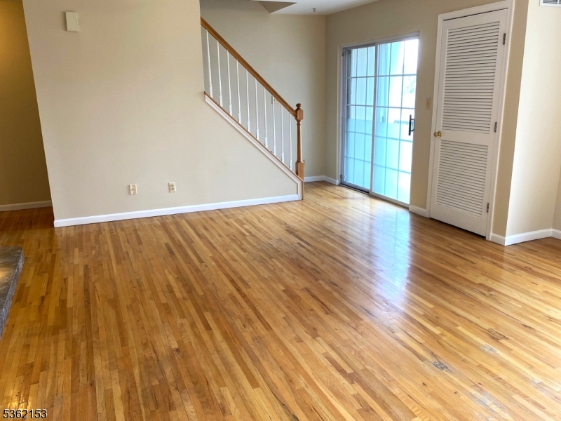 76 Union Street Newark, NJ 07105 - Photo 16 of 34 wooden floor in an empty room with a window