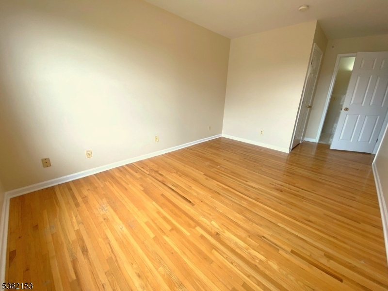76 Union Street Newark, NJ 07105 - Photo 21 of 34 a view of empty room with wooden floor