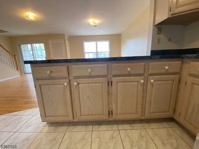 a view of a refrigerator in a kitchen