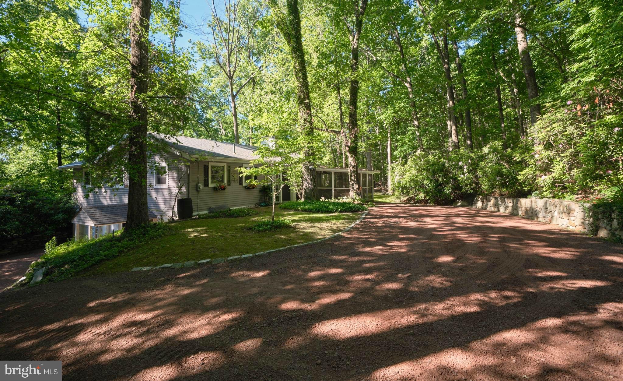 4831 Mountain Top Road West, Unit W New Hope, PA 18938 - Photo 1 of 28 Serene home nestled in lush greenery.
