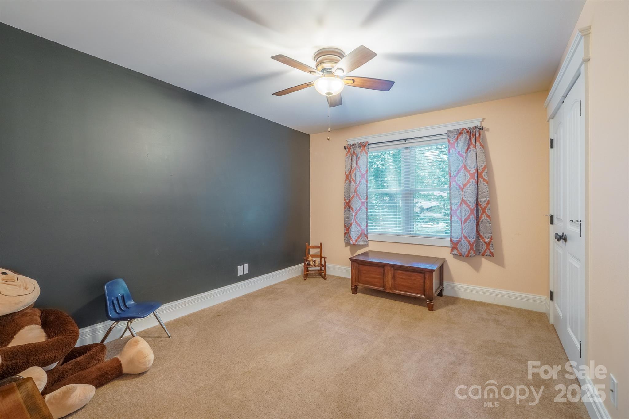 121 Jefferson Drive Locust, NC 28097 - Photo 15 of 22 a spacious bedroom with a bed and a chandelier