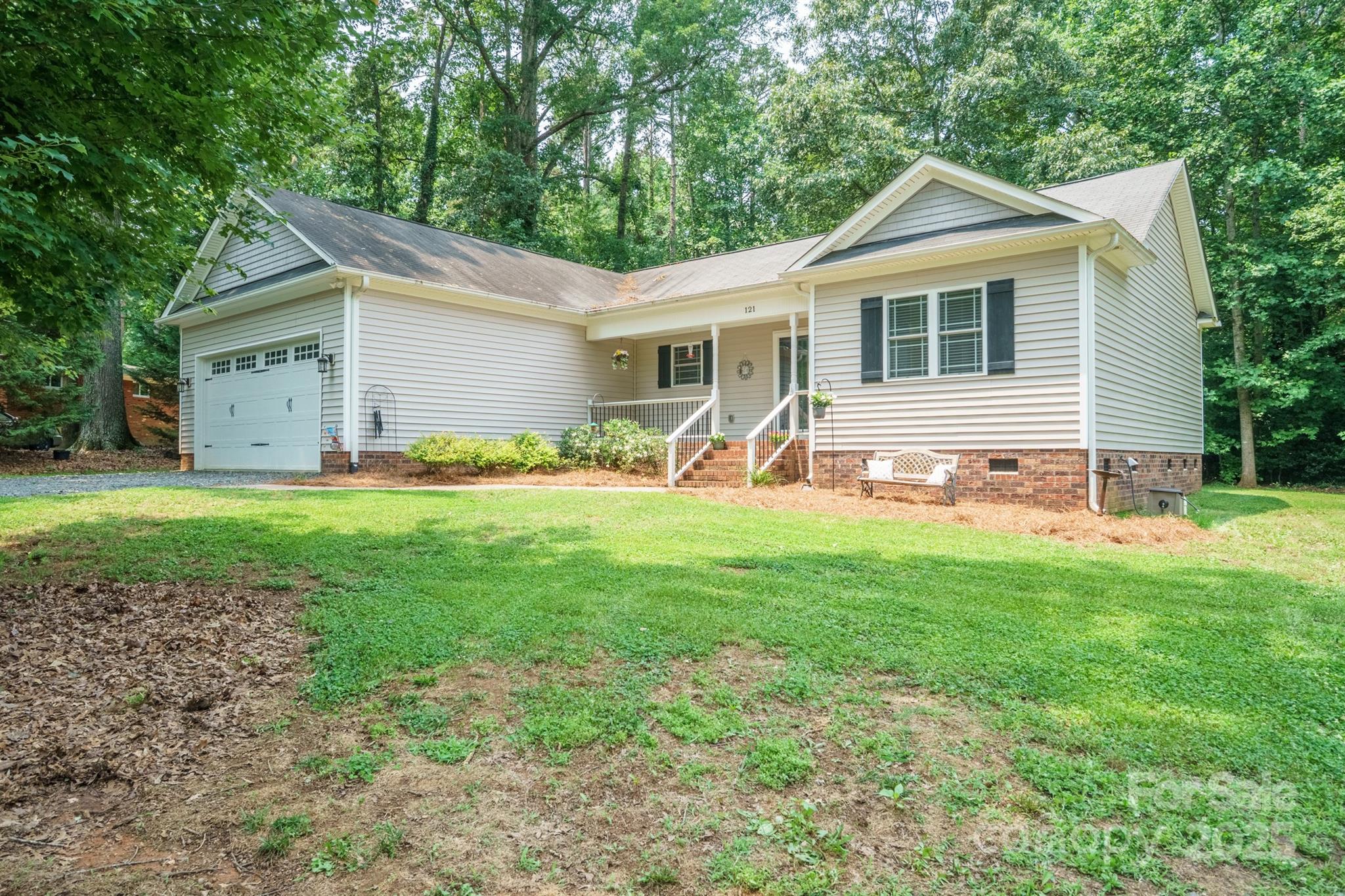 121 Jefferson Drive Locust, NC 28097 - Photo 2 of 22 a front view of house with yard and seating area