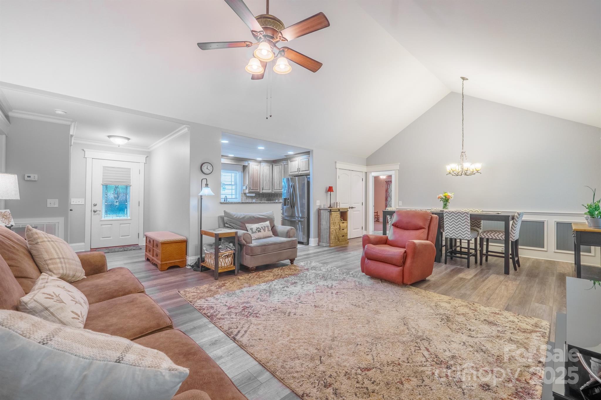 121 Jefferson Drive Locust, NC 28097 - Photo 3 of 22 a living room with furniture kitchen view and a chandelier