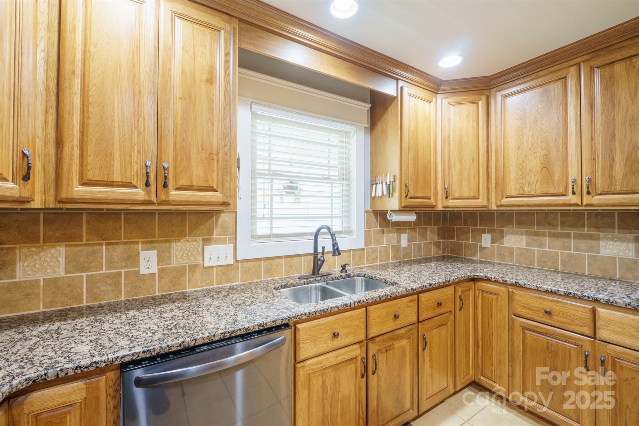 121 Jefferson Drive Locust, NC 28097 - Photo 6 of 22 a kitchen with stainless steel appliances granite countertop a sink and a cabinets next to a window