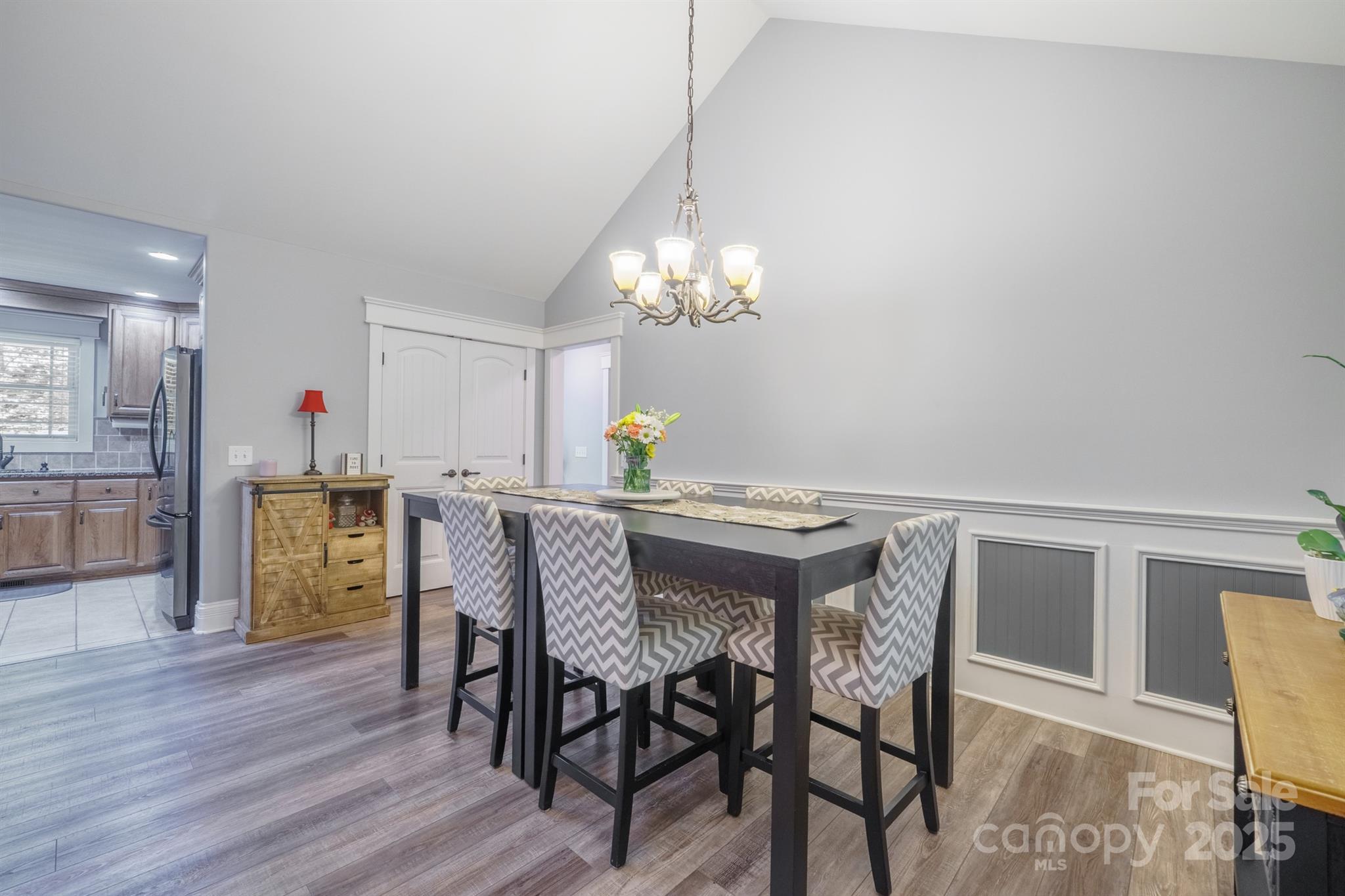 121 Jefferson Drive Locust, NC 28097 - Photo 9 of 22 a view of a dining room with furniture and wooden floor