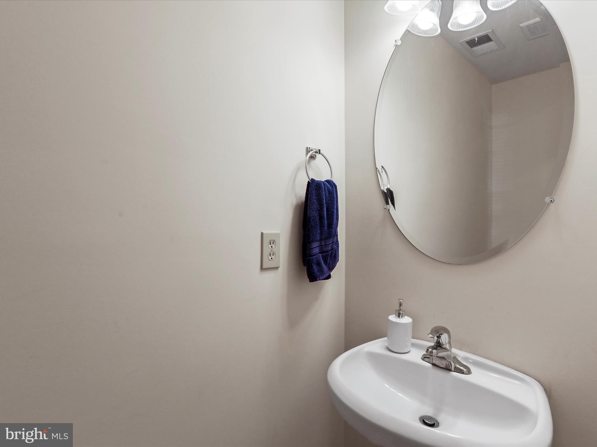 24 Fuzzy Tail Drive Ranson, WV 25438 - Photo 17 of 33 a bathroom with a sink and mirror