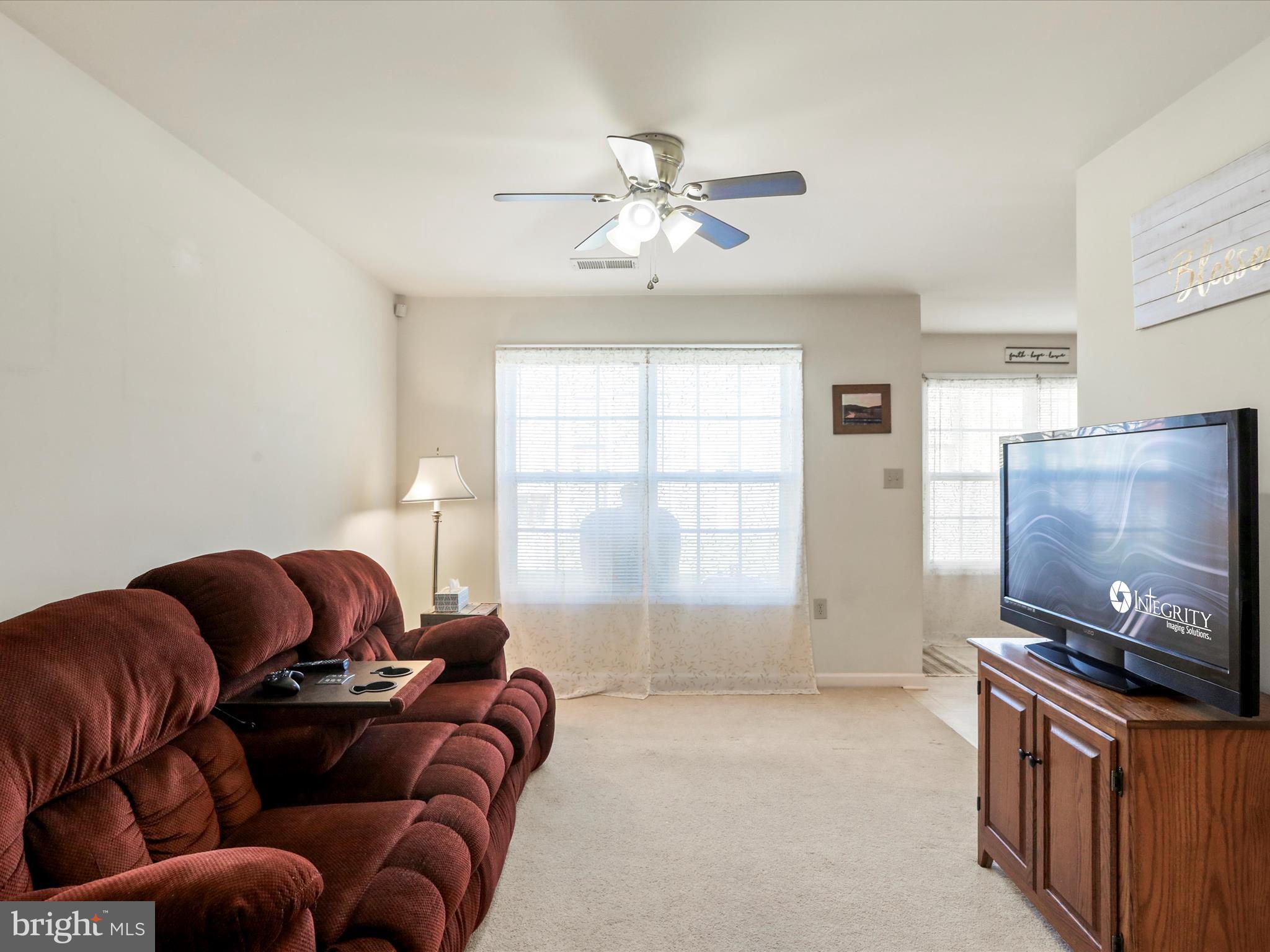 24 Fuzzy Tail Drive Ranson, WV 25438 - Photo 8 of 33 a living room with furniture and a flat screen tv