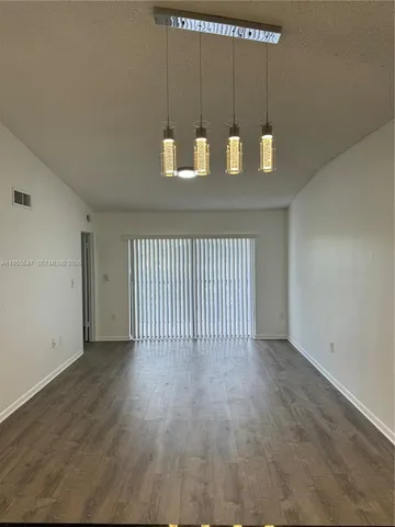 a view of a livingroom with wooden floor