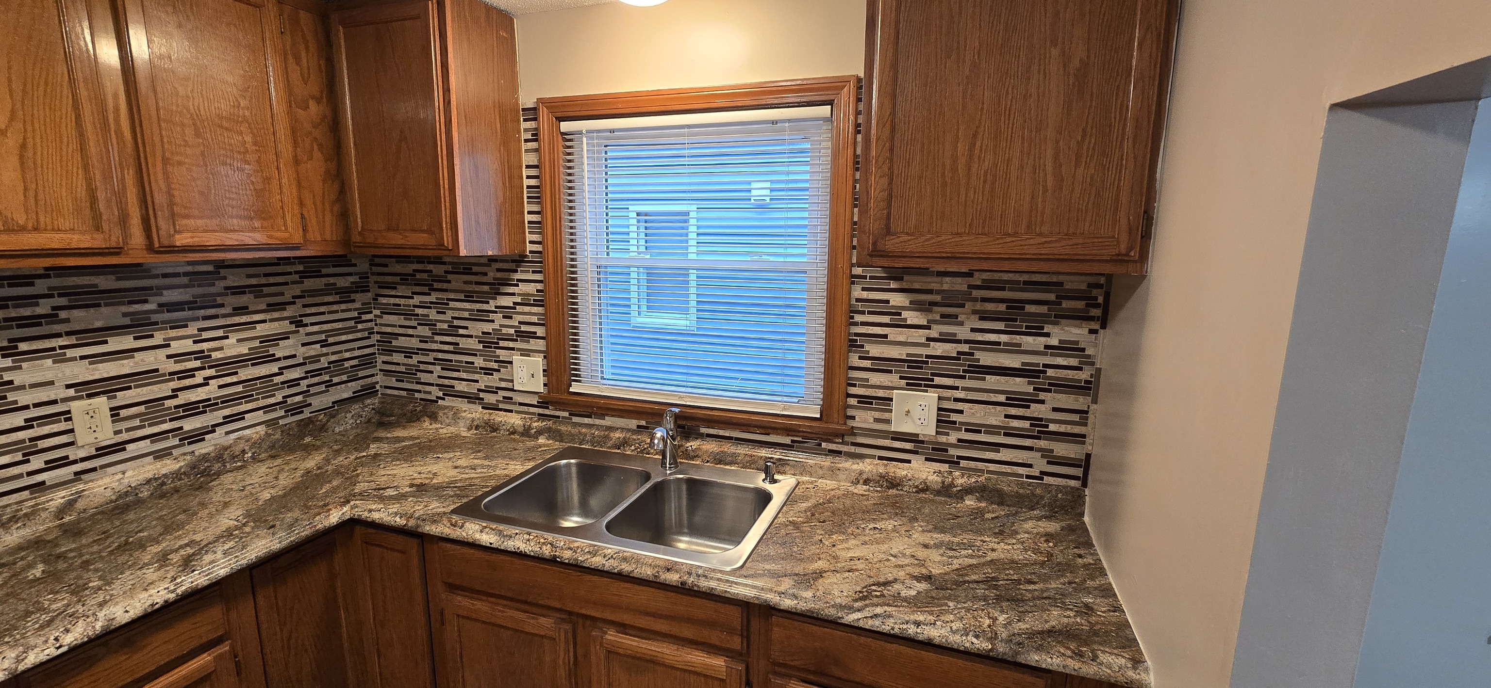 2319 Main Street Hartford, CT 06120 - Photo 2 of 9 a kitchen with granite countertop a sink and a stove