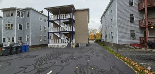 a view of a house with backyard