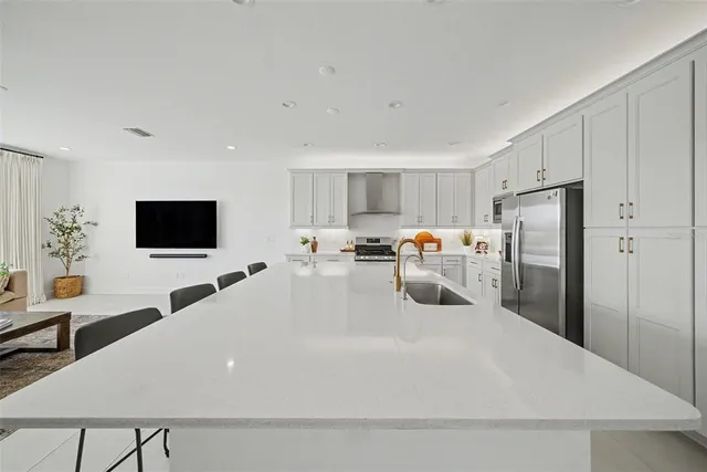 an empty room with windows and ceiling fan