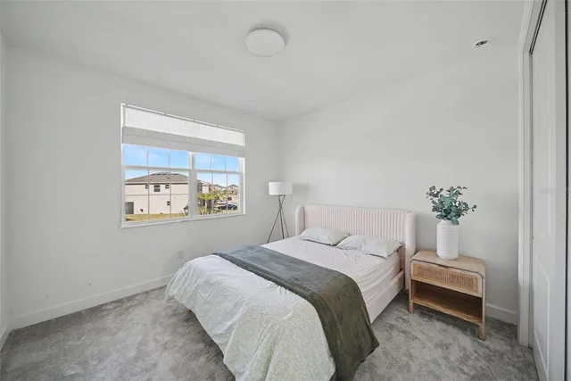 a view of a lake with houses in the background