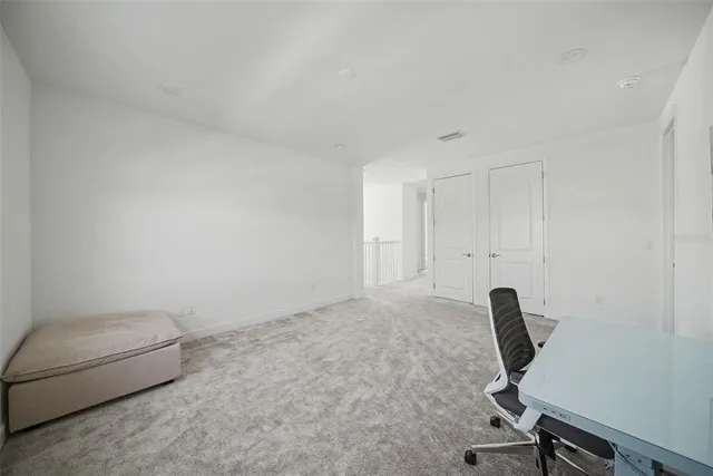 a view of a lake with houses in the back