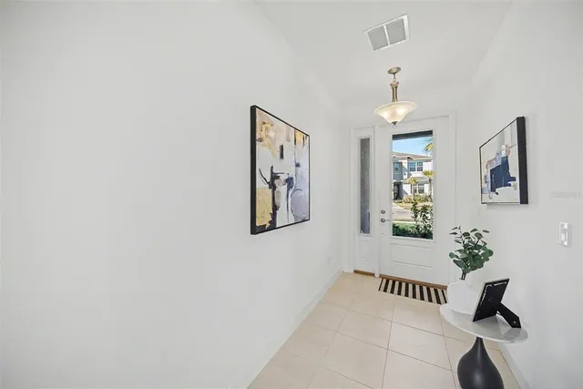 a living room with furniture a rug and a table