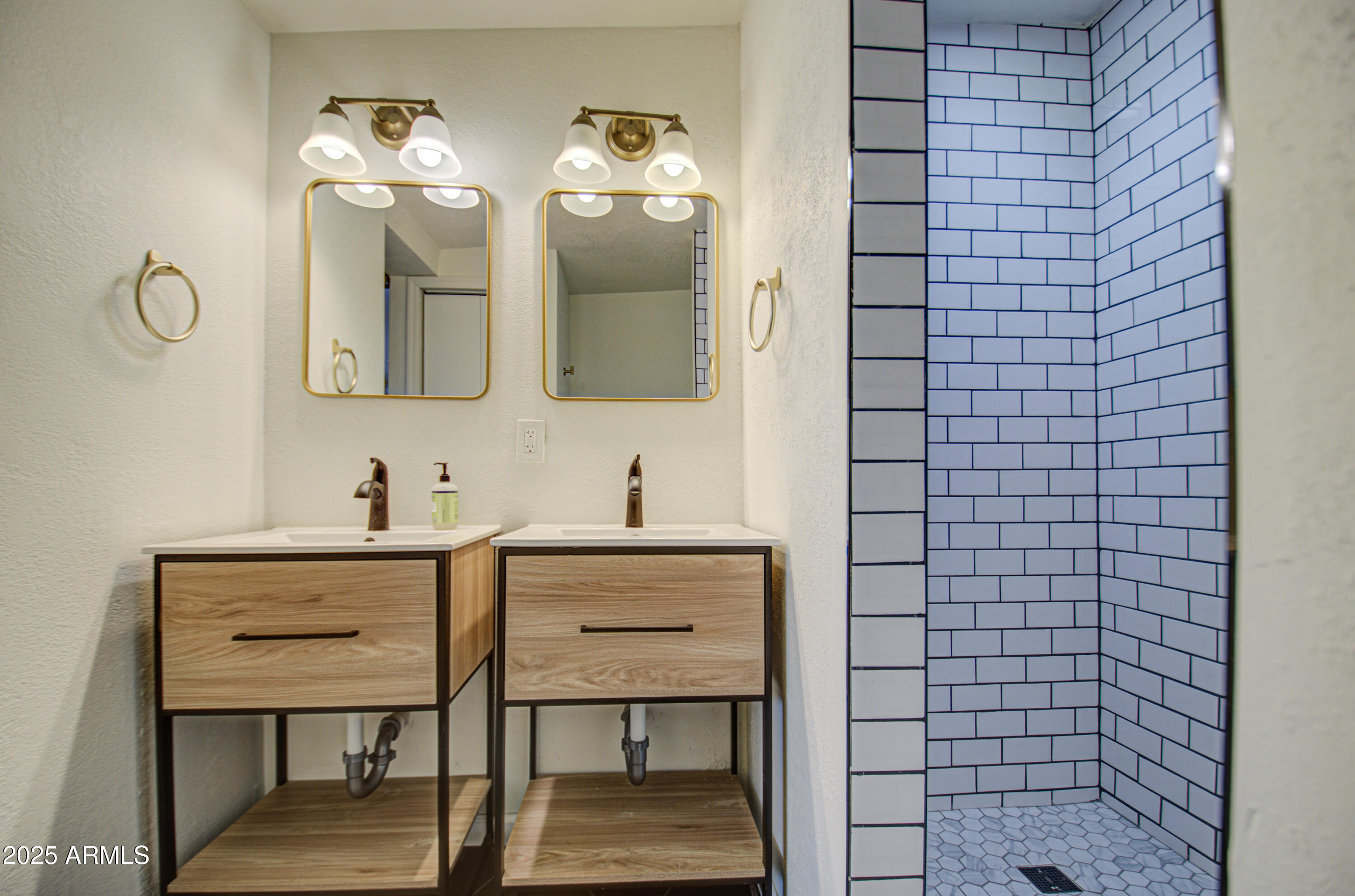 2937 East Osborn Road Phoenix, AZ 85016 - Photo 21 of 59 a bathroom with a sink mirror and vanity