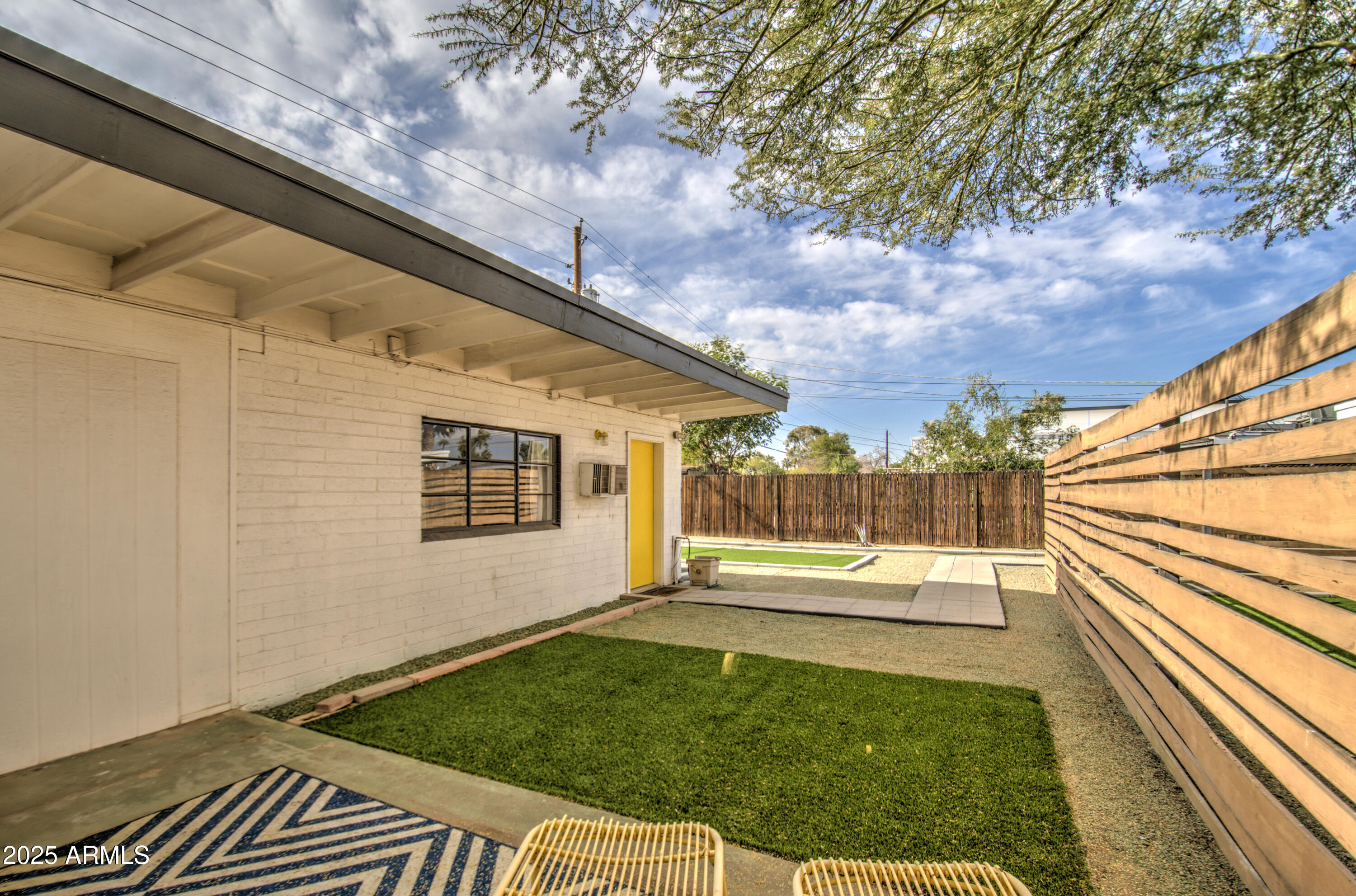 2937 East Osborn Road Phoenix, AZ 85016 - Photo 29 of 59 a backyard of a house with table and chairs