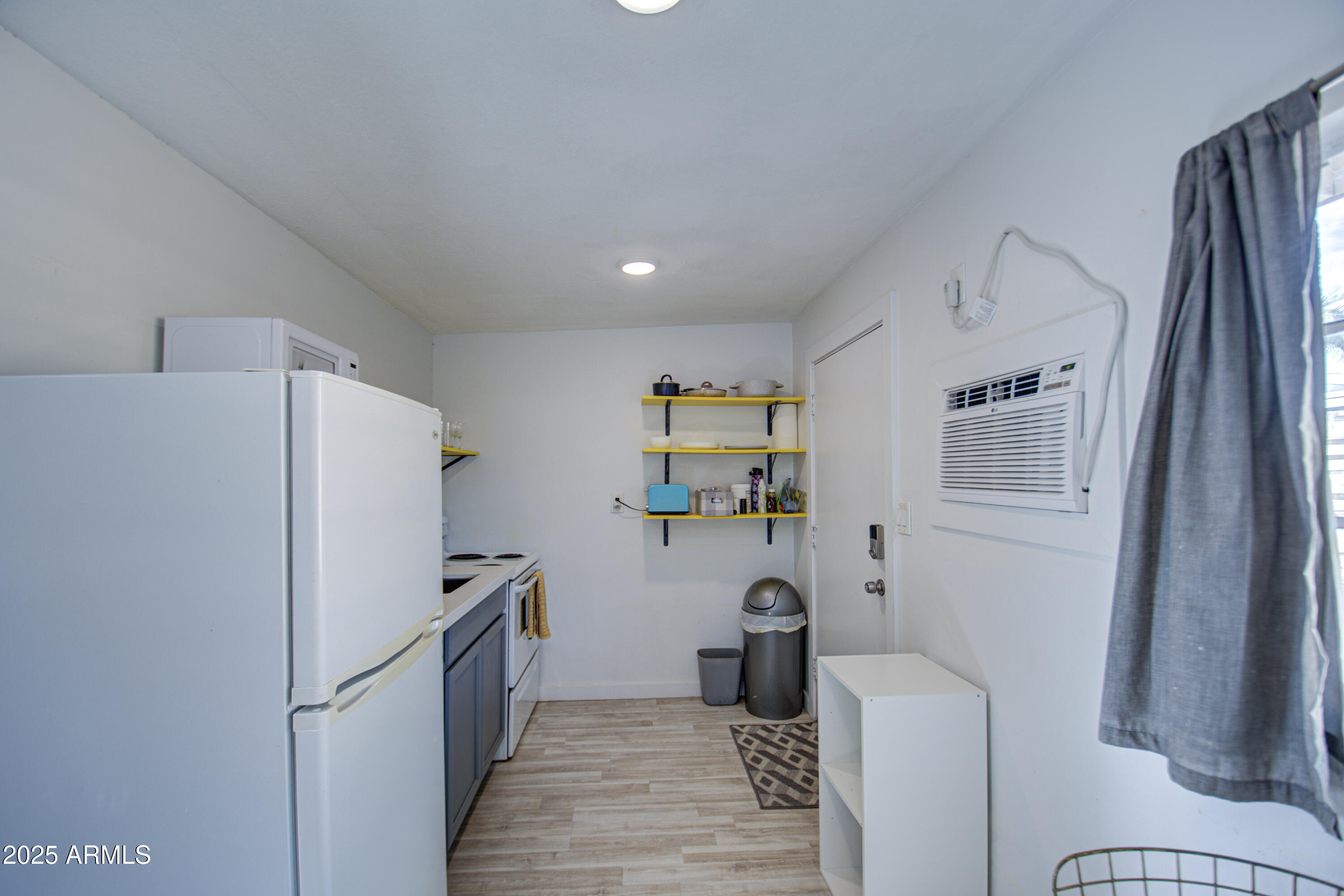 2937 East Osborn Road Phoenix, AZ 85016 - Photo 35 of 59 a kitchen with stainless steel appliances a refrigerator and a stove