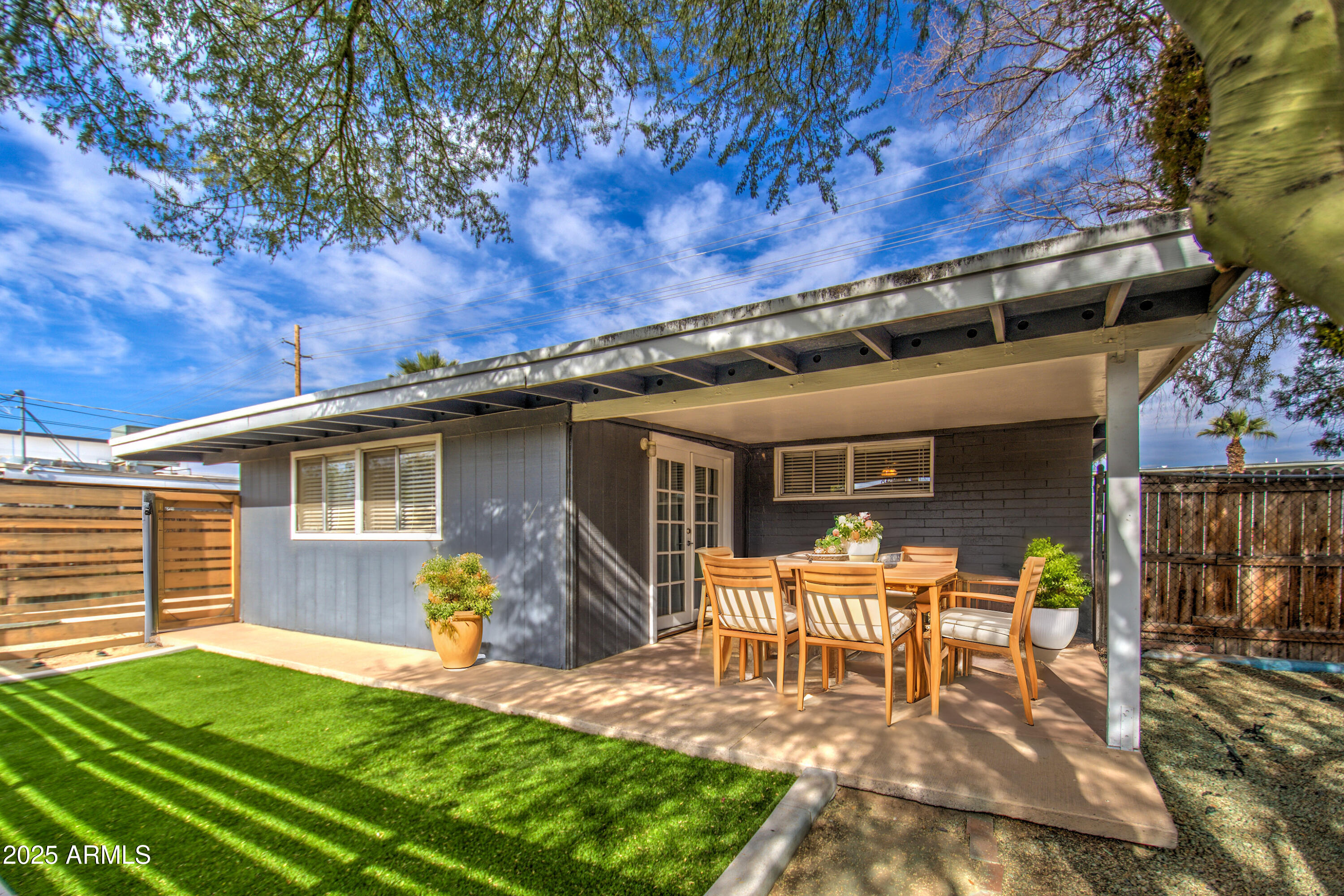 2937 East Osborn Road Phoenix, AZ 85016 - Photo 44 of 59 a backyard of a house with table and chairs