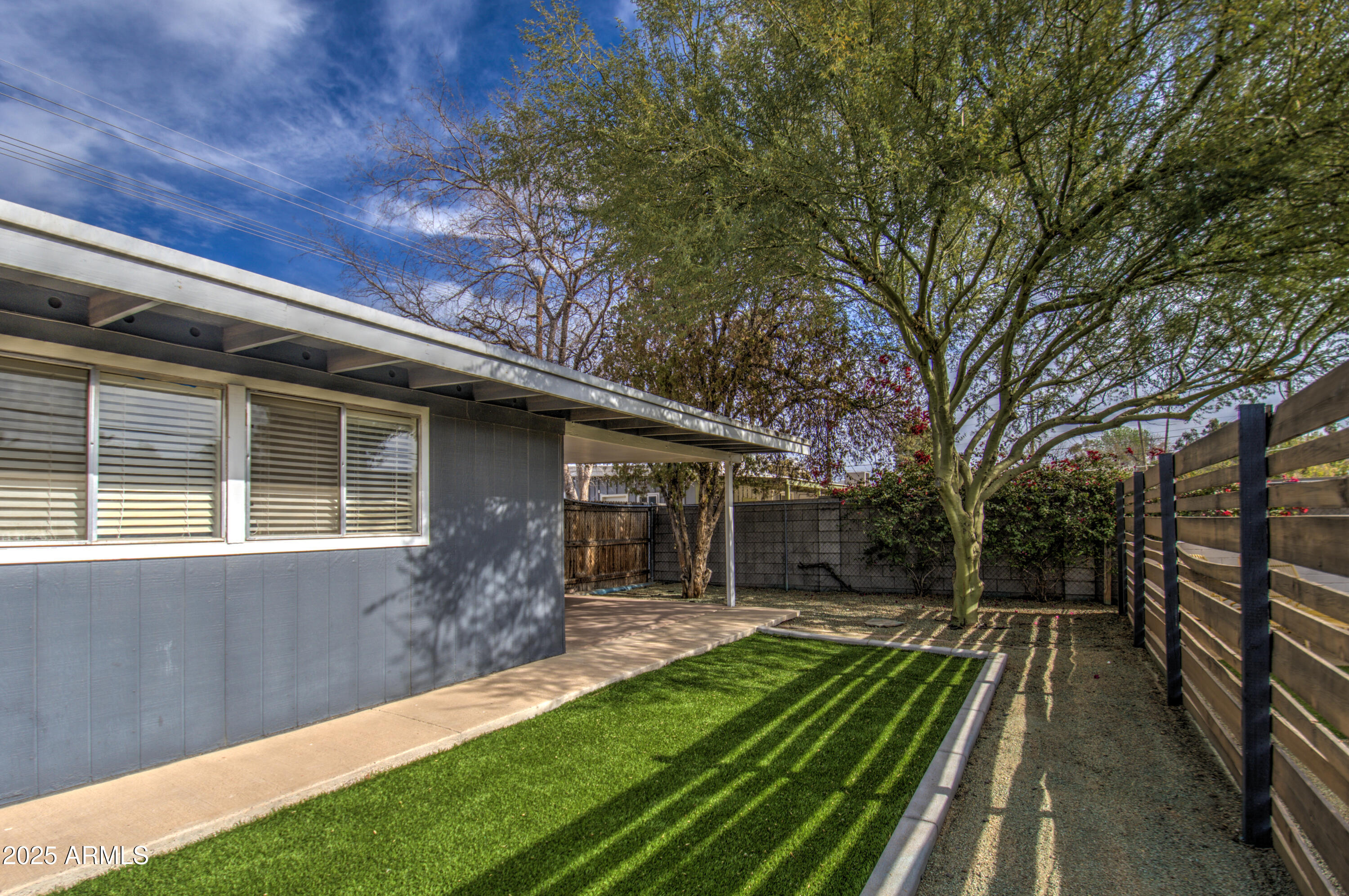 2937 East Osborn Road Phoenix, AZ 85016 - Photo 45 of 59 a view of house with backyard and trees