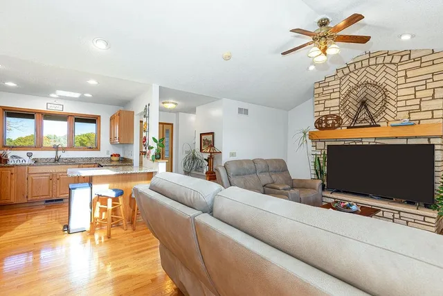a view of living room with granite countertop furniture and painting on the wall