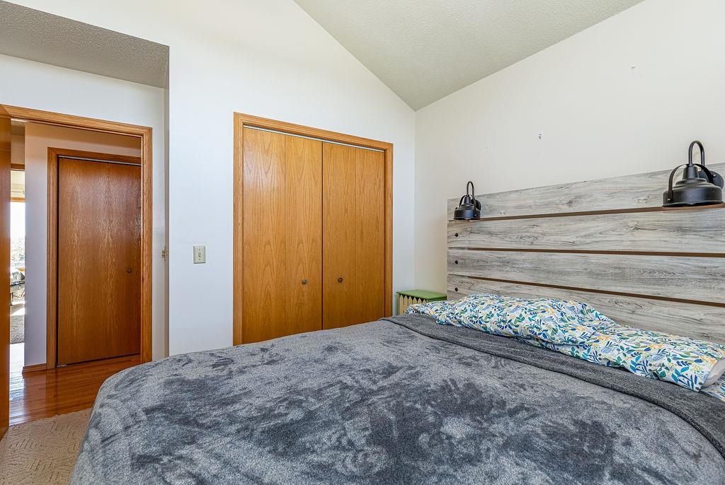 405 West Wachter Road Galena, IL 61036 - Photo 34 of 57 a bedroom with a bed and wooden floor