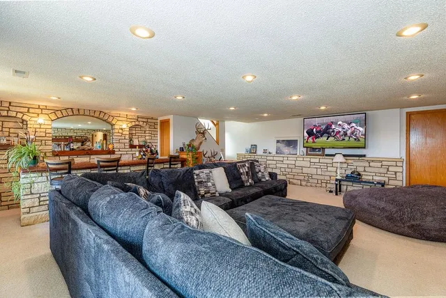 a bedroom with a bed and a couch