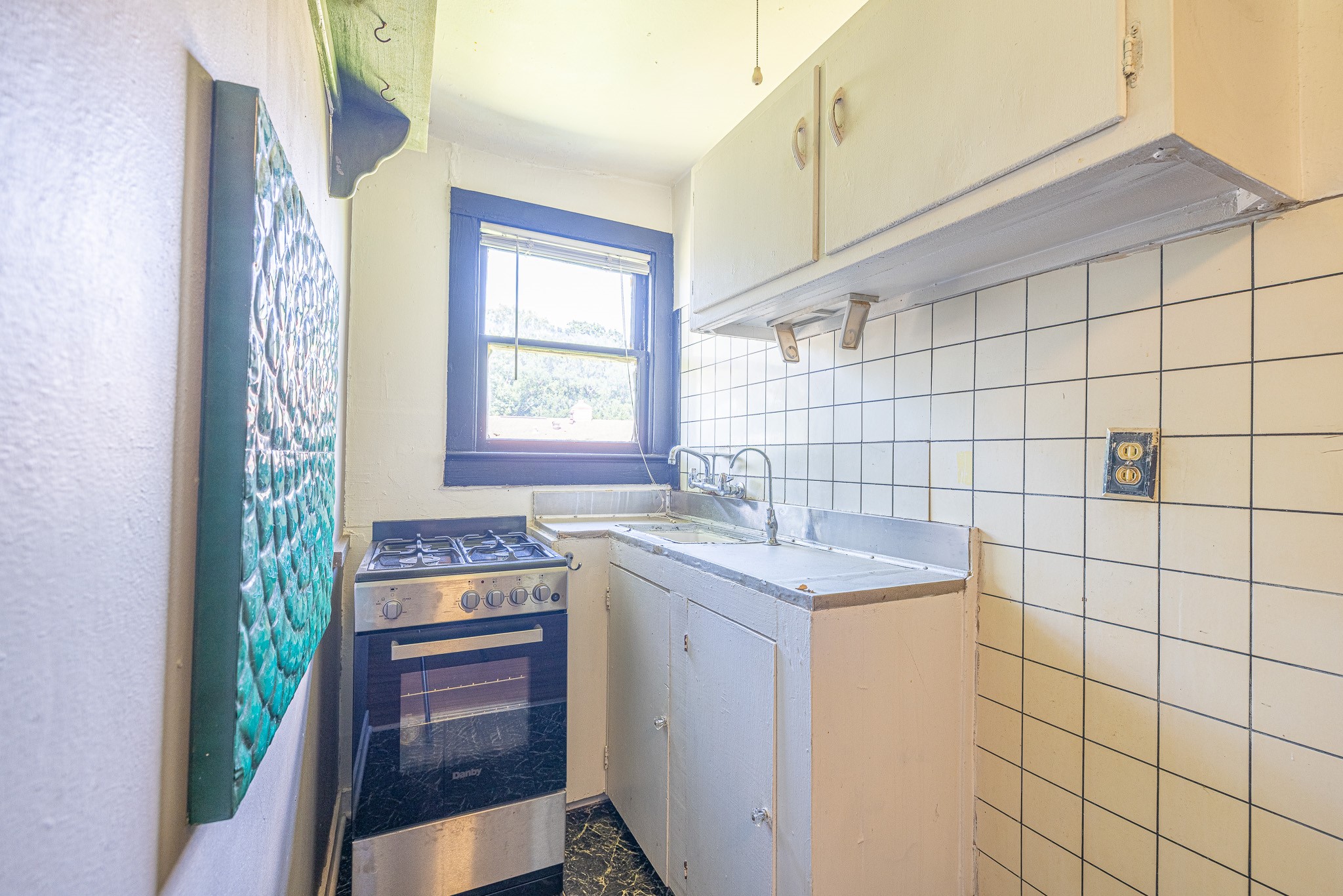 8548 Findlay Street Houston, TX 77017 - Photo 44 of 50 a utility room with a sink a washer and dryer