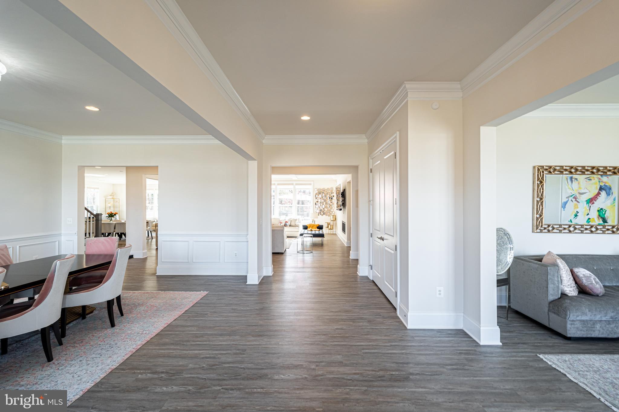 1059 Marmion Drive Herndon, VA 20170 - Photo 3 of 92 a view of a hallway with wooden floor and furniture