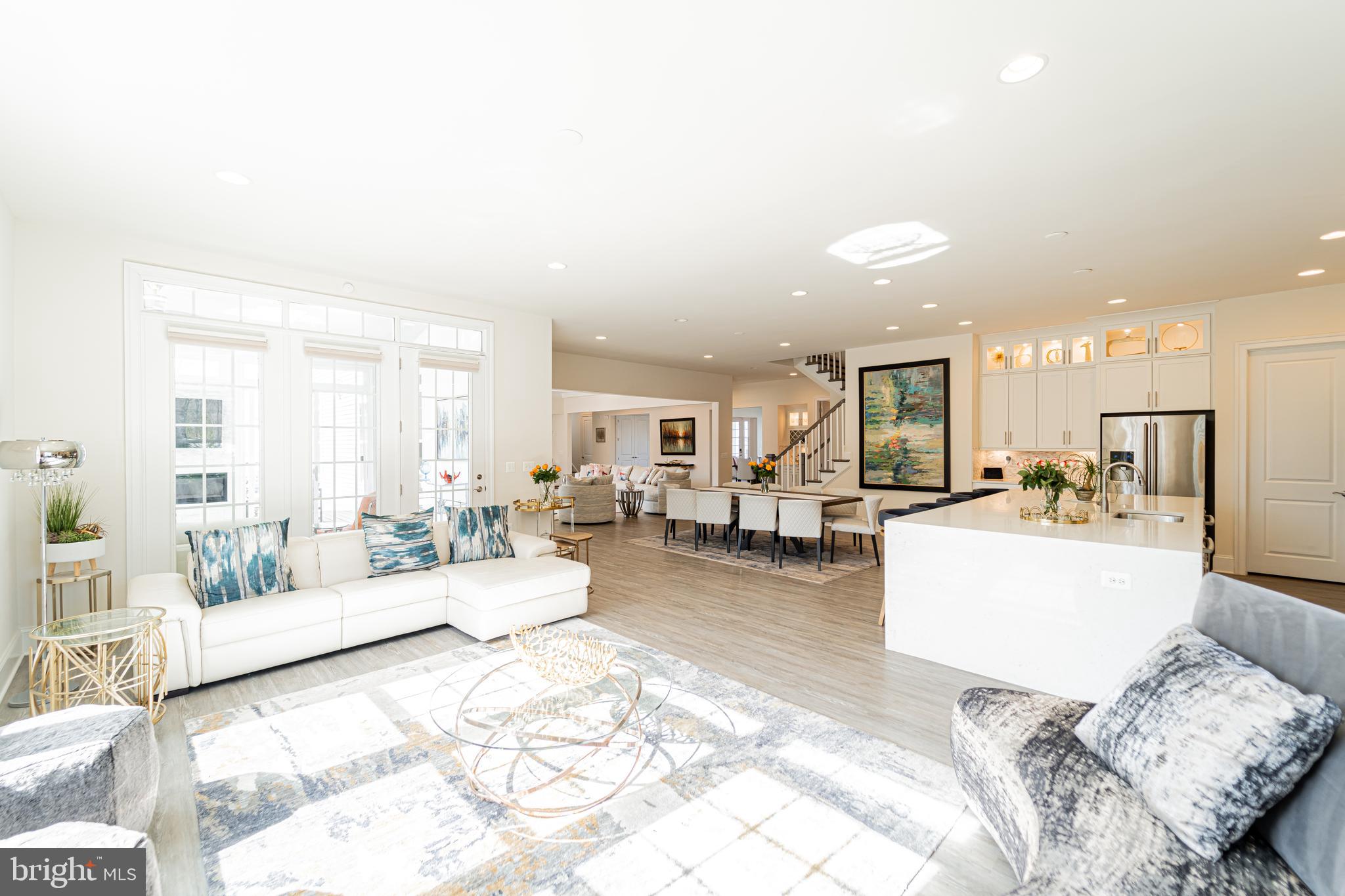 1059 Marmion Drive Herndon, VA 20170 - Photo 32 of 92 a living room with furniture and a dining table with kitchen view