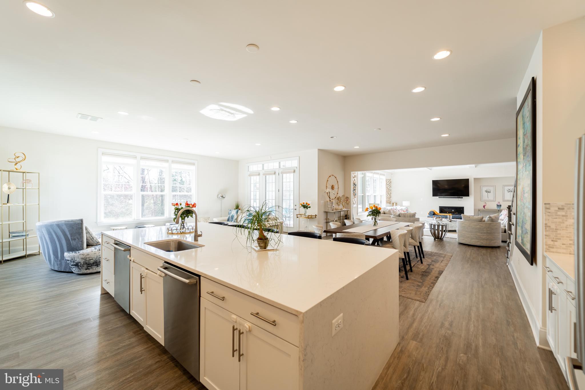 1059 Marmion Drive Herndon, VA 20170 - Photo 37 of 92 a view of a kitchen with a large counter top appliances a sink and living room view
