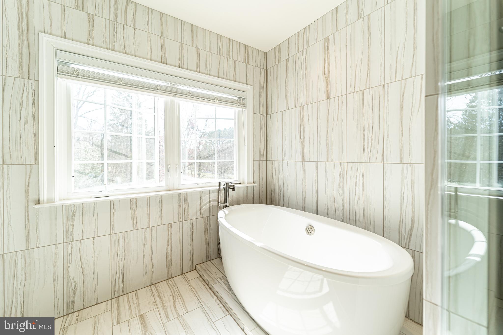 1059 Marmion Drive Herndon, VA 20170 - Photo 50 of 92 a white bath tub sitting next to a white toilet