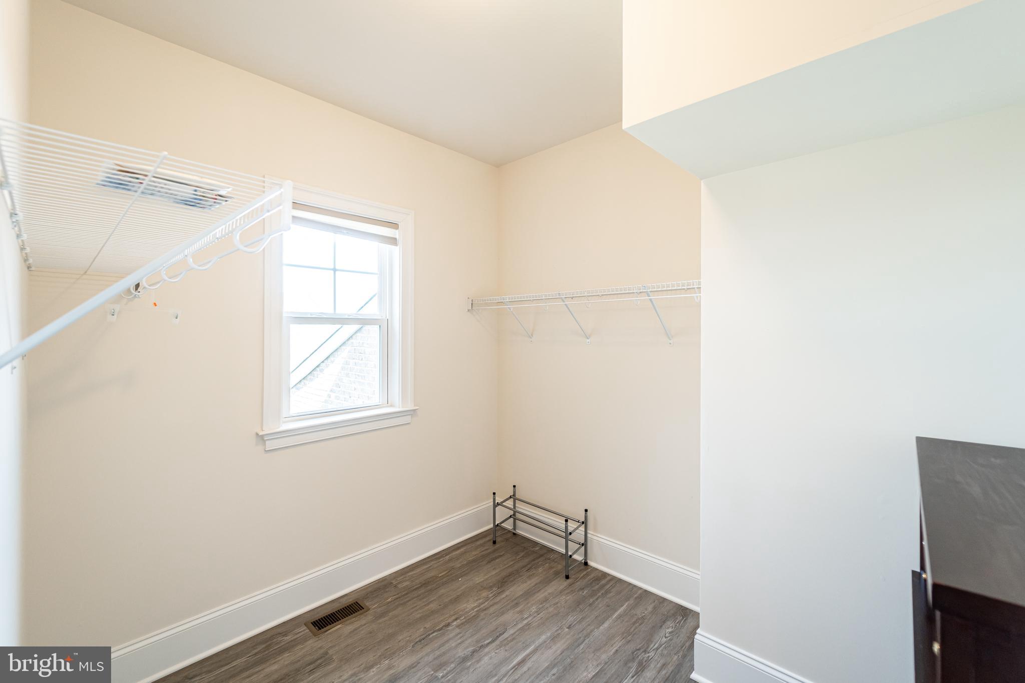 1059 Marmion Drive Herndon, VA 20170 - Photo 57 of 92 an empty room with wooden floor and windows