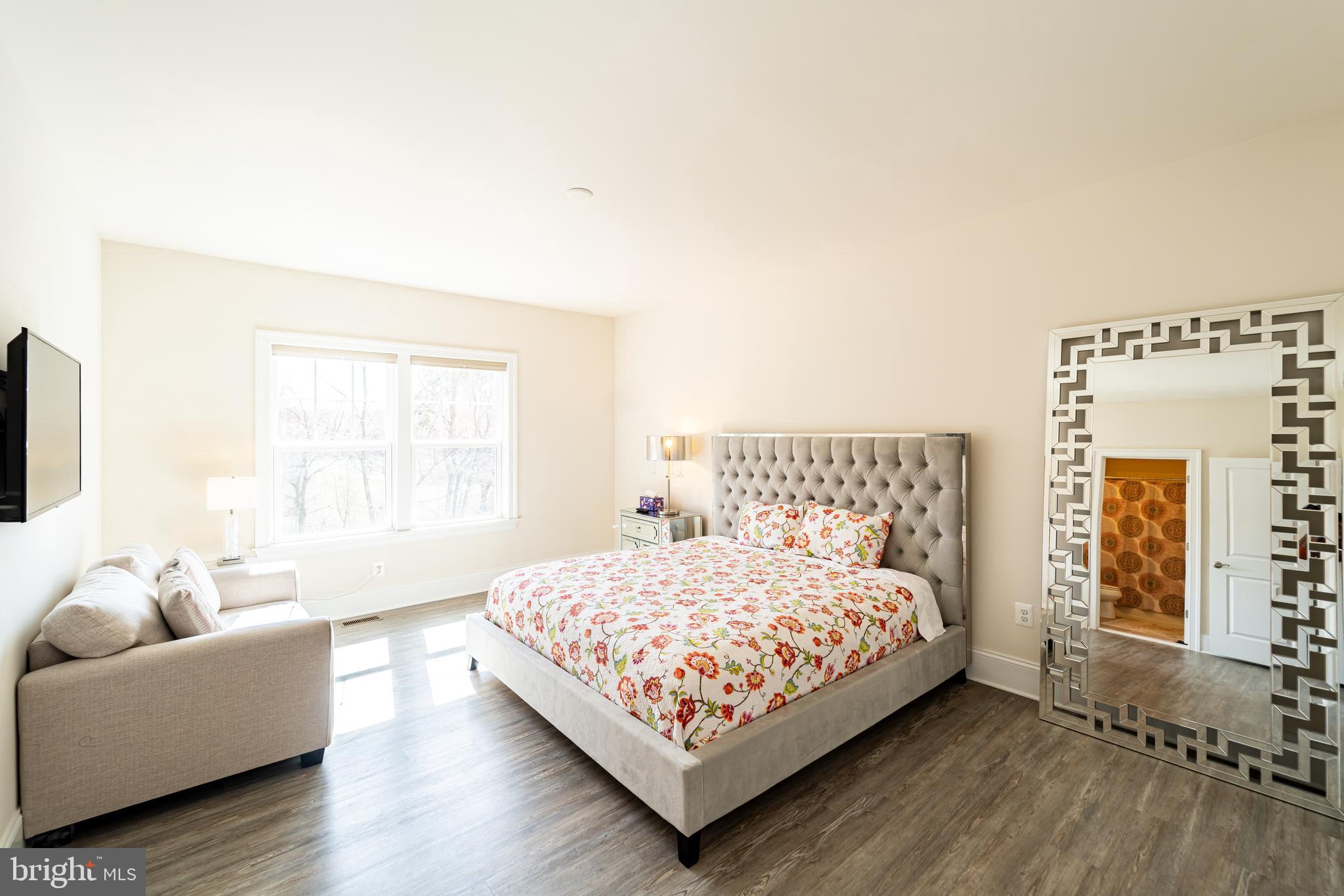 1059 Marmion Drive Herndon, VA 20170 - Photo 65 of 92 a bedroom with a bed and a couch