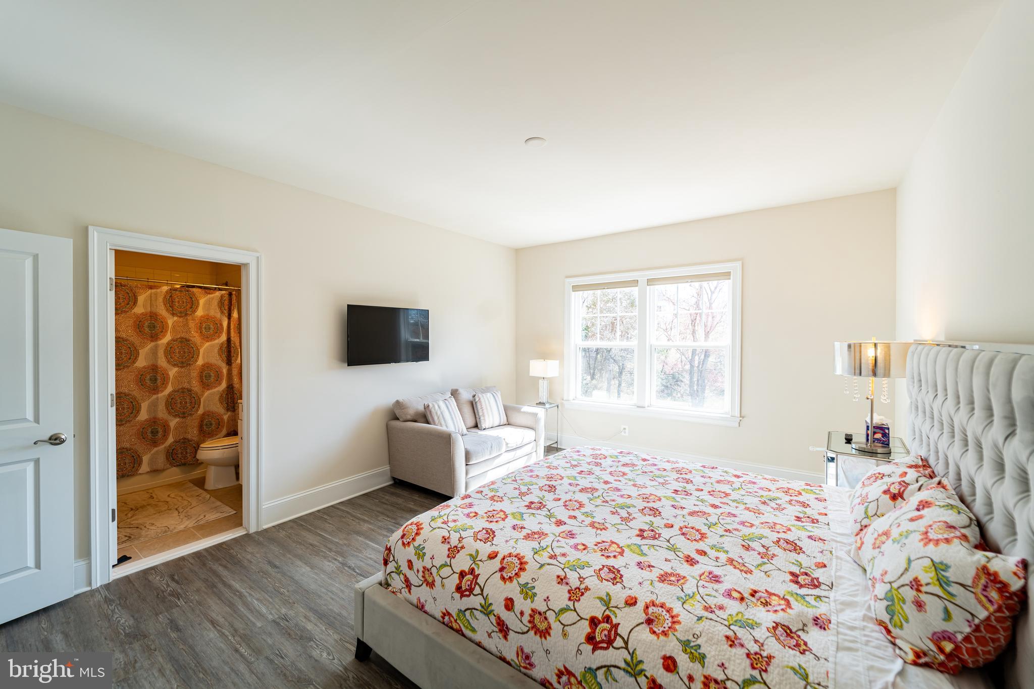 1059 Marmion Drive Herndon, VA 20170 - Photo 66 of 92 a bedroom with a bed and wooden floor