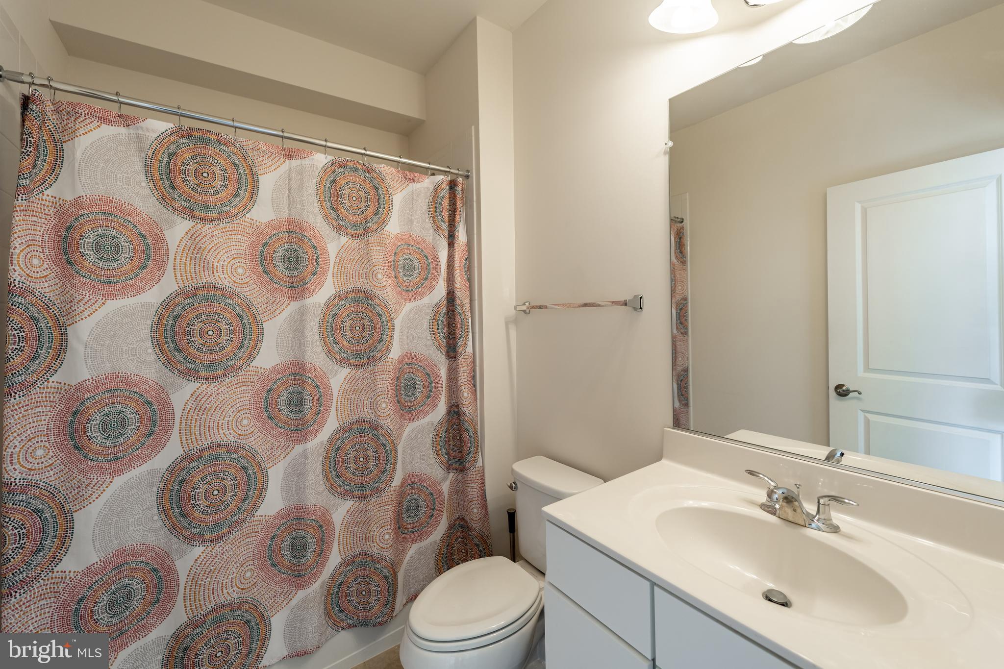 1059 Marmion Drive Herndon, VA 20170 - Photo 67 of 92 a bathroom with a sink and mirror with toilet