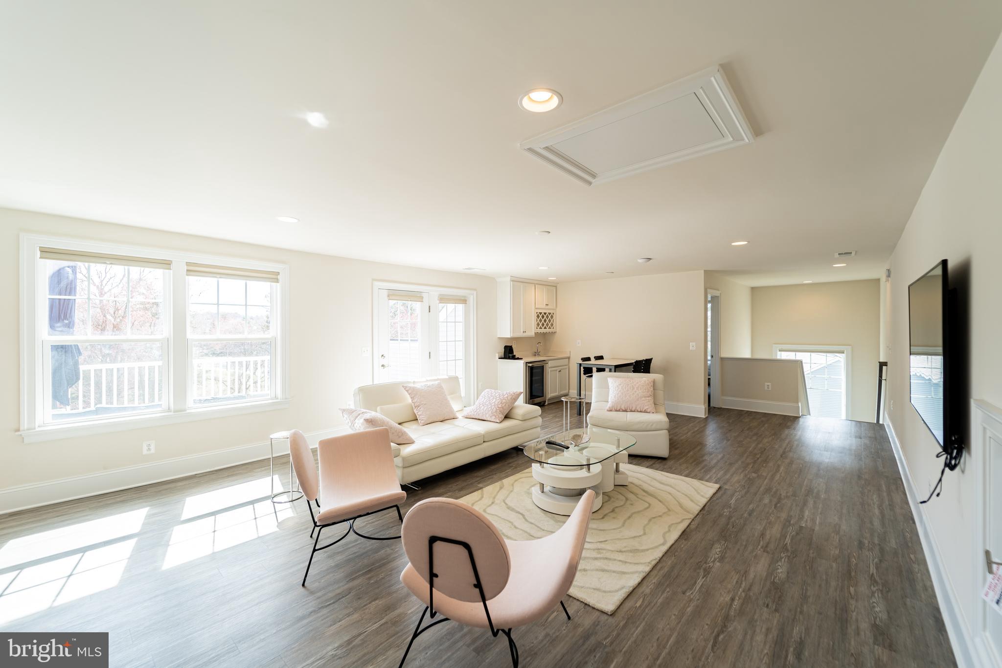 1059 Marmion Drive Herndon, VA 20170 - Photo 71 of 92 a living room with furniture and a flat screen tv