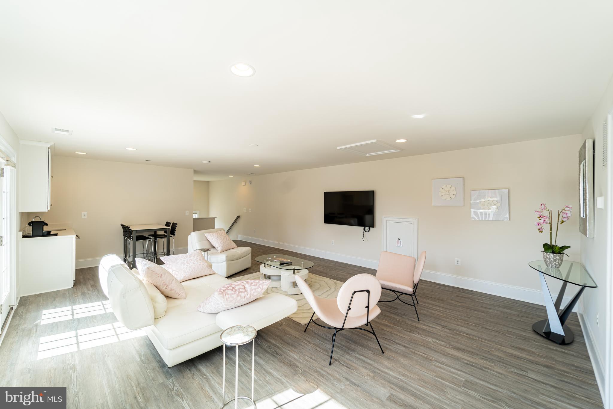 1059 Marmion Drive Herndon, VA 20170 - Photo 72 of 92 a living room with furniture and a flat screen tv