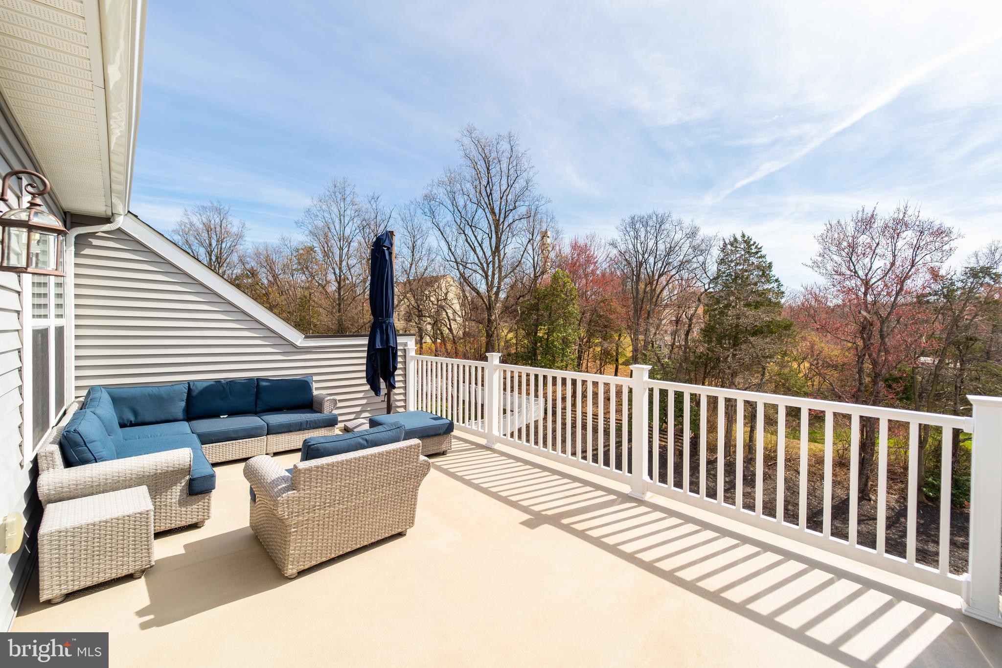 1059 Marmion Drive Herndon, VA 20170 - Photo 75 of 92 a view of a roof deck with couches and wooden fence