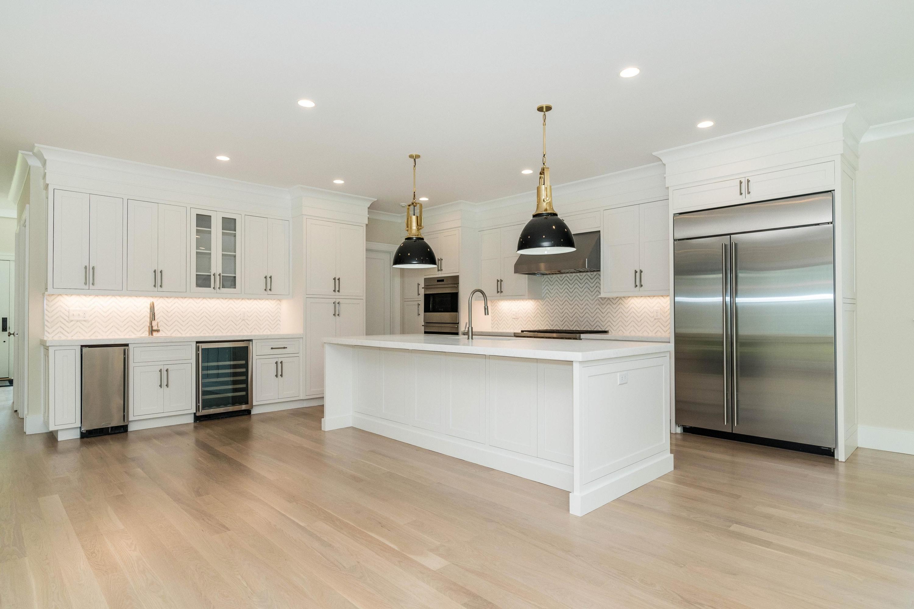 207 Hollow Tree Ridge Road Darien, CT 06820 - Photo 10 of 34 a kitchen with stainless steel appliances a refrigerator sink and cabinets