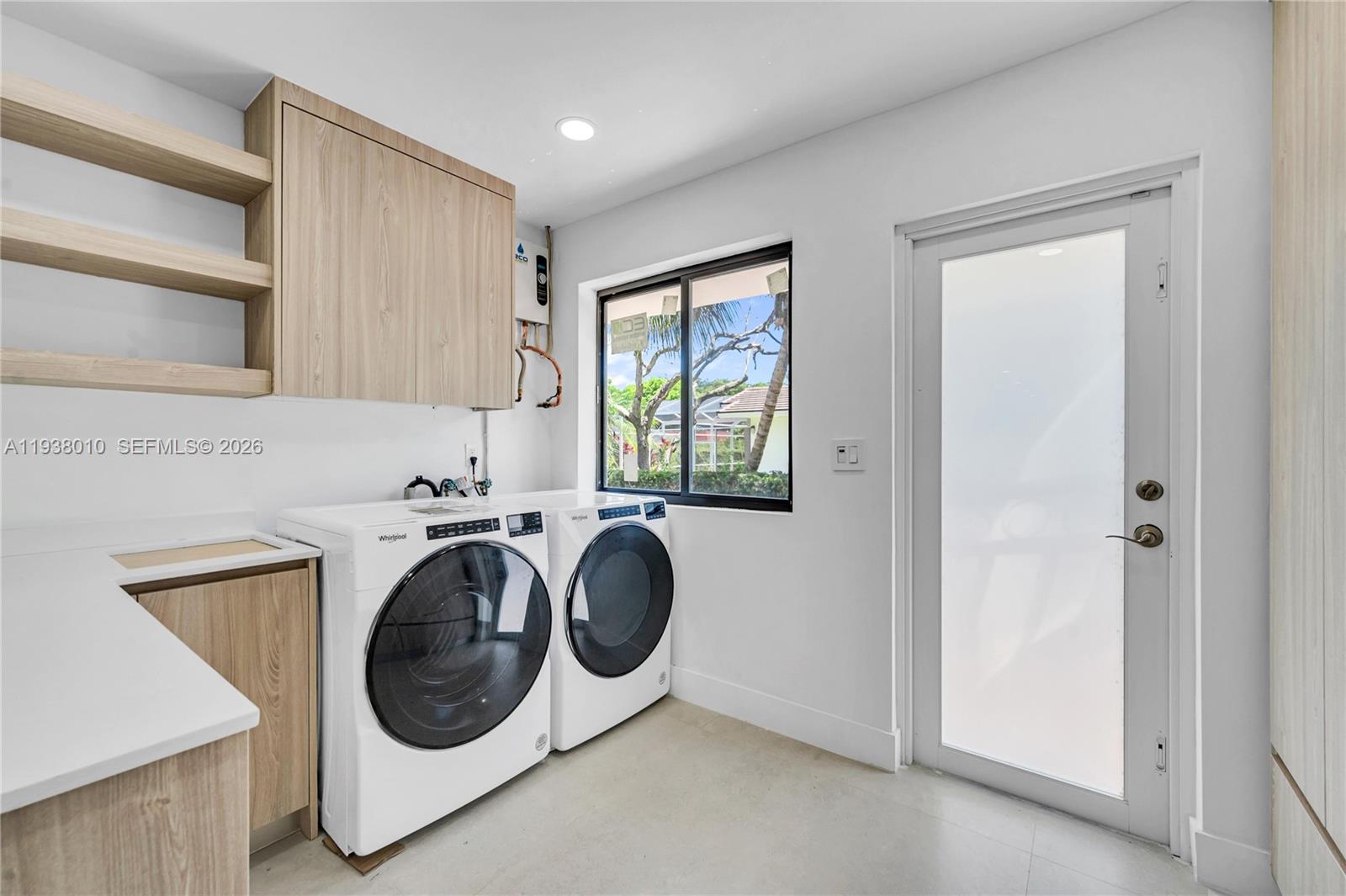 13407 Southwest 59th Avenue Pinecrest, FL 33156 - Photo 23 of 50 a utility room with sink dryer and washer