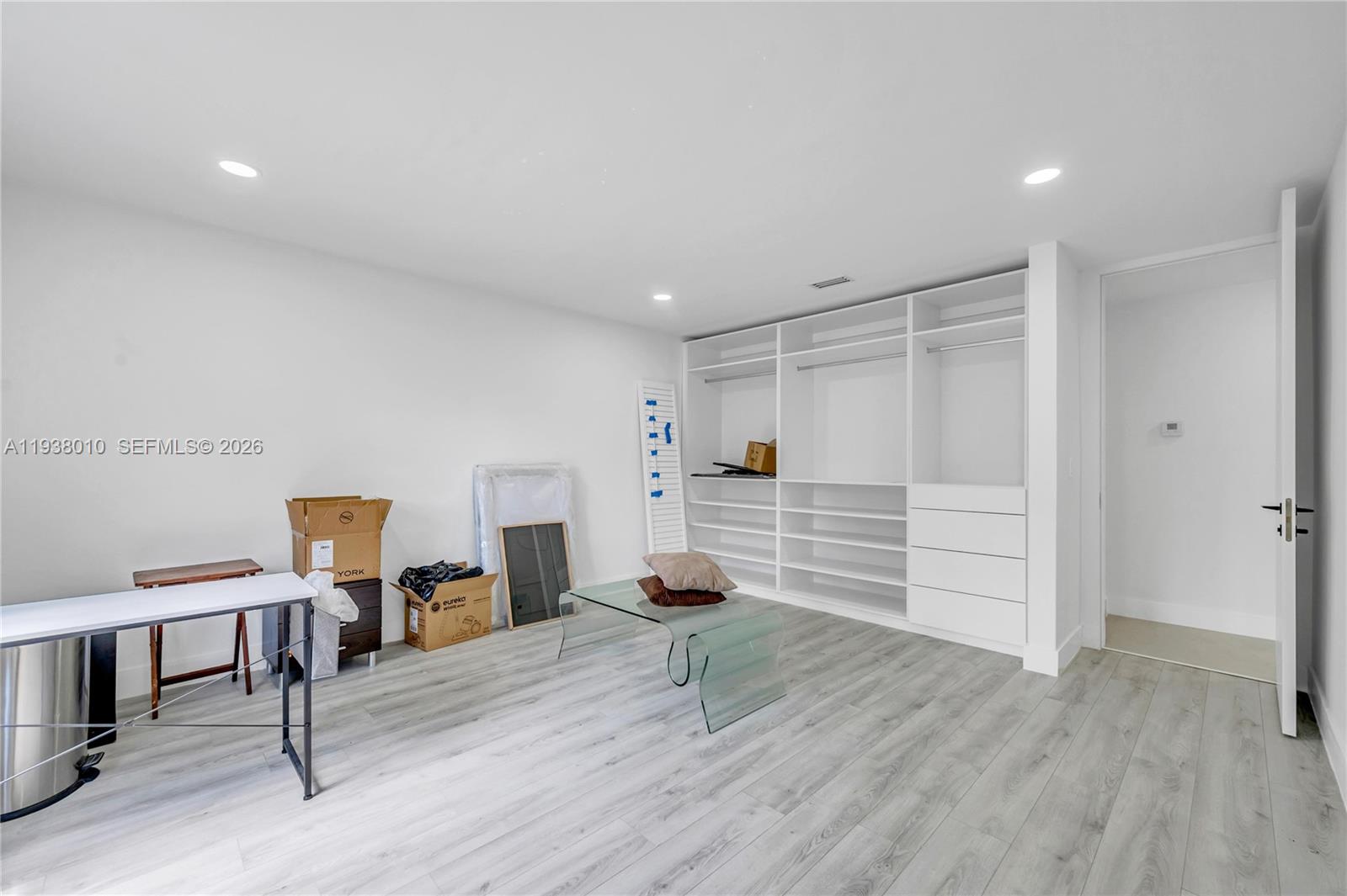 13407 Southwest 59th Avenue Pinecrest, FL 33156 - Photo 33 of 50 a room with furniture and wooden floor