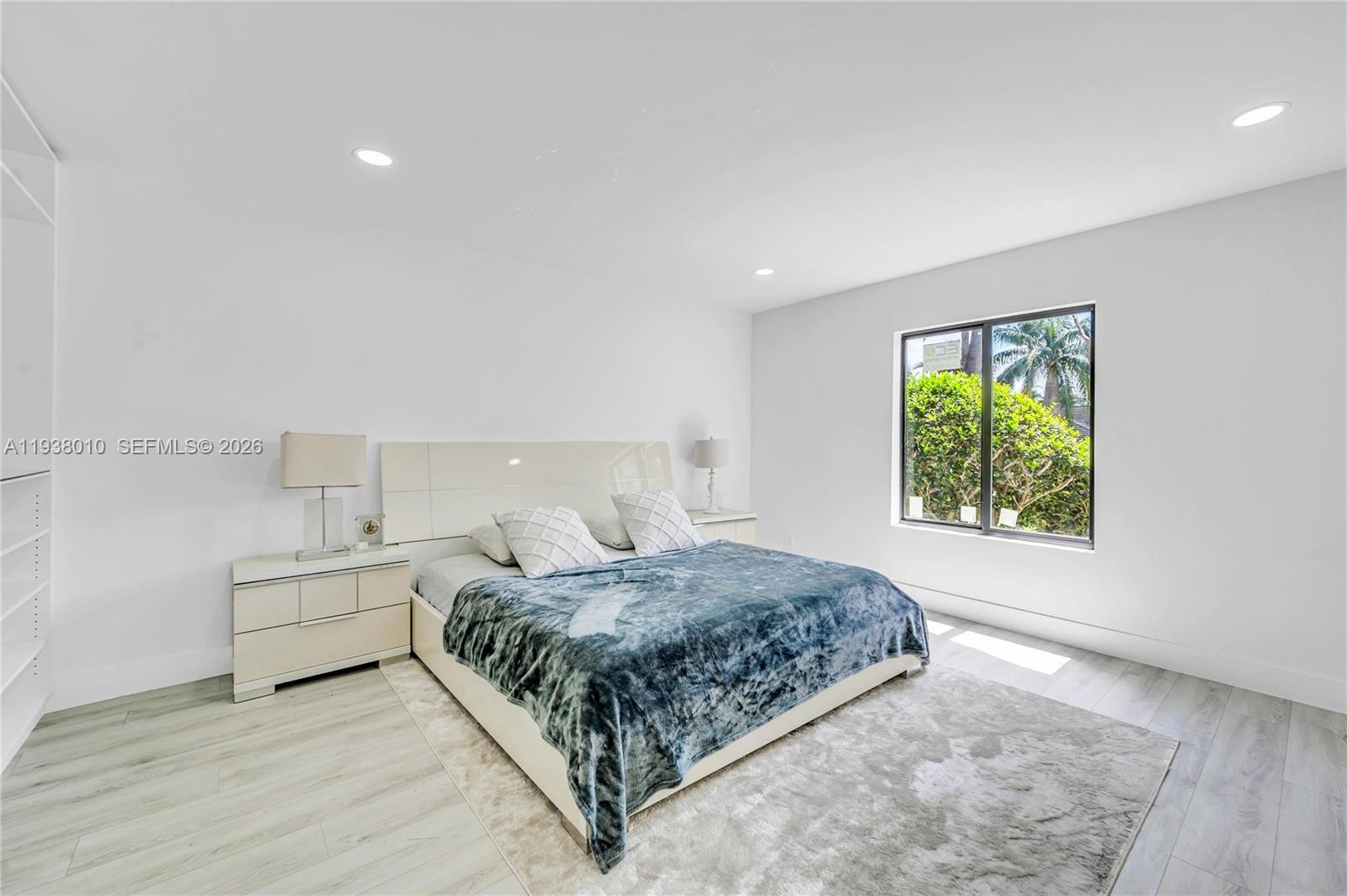 13407 Southwest 59th Avenue Pinecrest, FL 33156 - Photo 34 of 50 a bedroom with a bed and a window