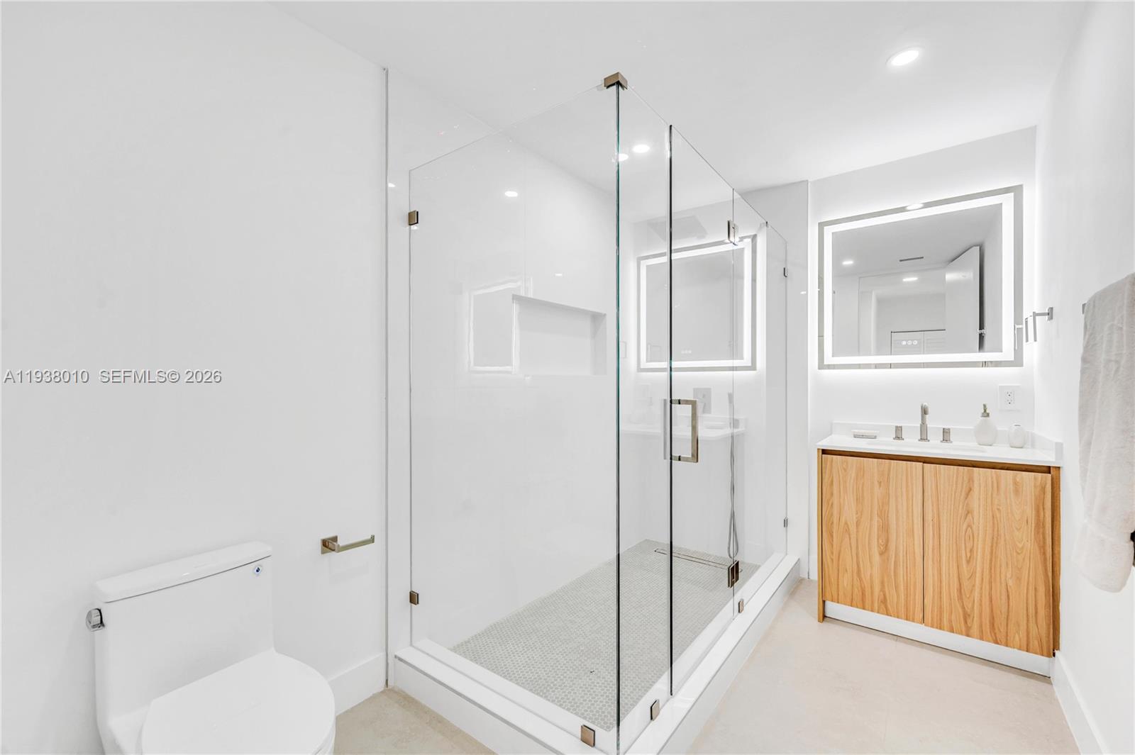 13407 Southwest 59th Avenue Pinecrest, FL 33156 - Photo 38 of 50 a bathroom with a shower and a toilet
