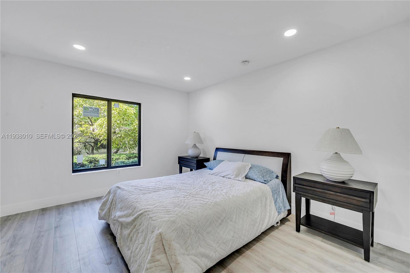 13407 Southwest 59th Avenue Pinecrest, FL 33156 - Photo 39 of 50 a bedroom with a bed and a window
