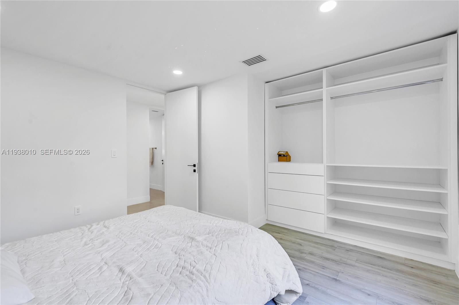 13407 Southwest 59th Avenue Pinecrest, FL 33156 - Photo 40 of 50 a room with a hardwood and a ceiling fan