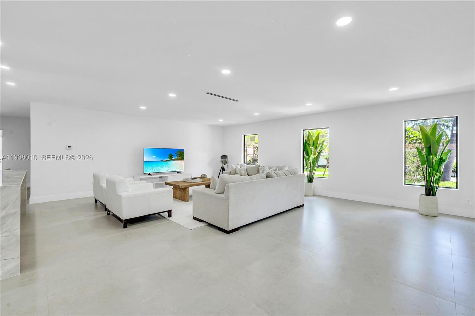 13407 Southwest 59th Avenue Pinecrest, FL 33156 - Photo 9 of 50 a living room with furniture and a wooden floor