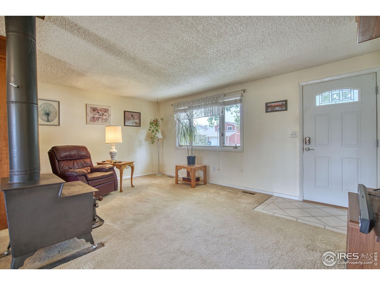 725 Bruce Drive Berthoud, CO 80513 - Photo 7 of 21 a living room with furniture and a window