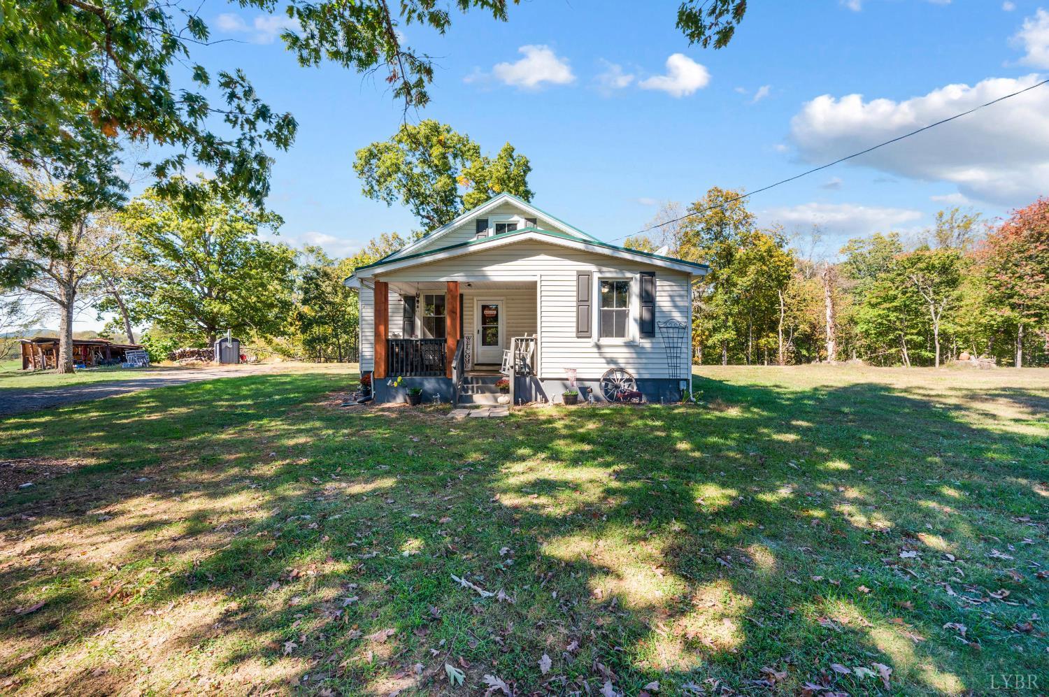 342 Toll Gate Road Concord, VA 24538 - Photo 1 of 48 a front view of a house with garden